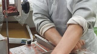 Frozen meat cutting on machine