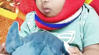 Baby playing with toy