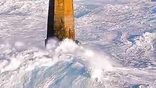 Waves hit lighthouses