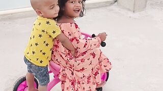 My kids cycling at terrace