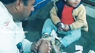 The Little Boy Playing with Money