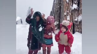 Cute little Kids are playing with snow in (arangkel)Neelum valley of kashmir.