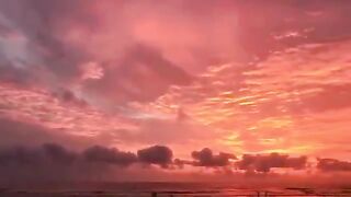 orange and pink hues of the setting sun