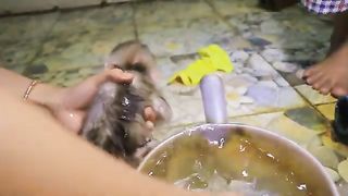 Timing for taking a bath First Cleaning water, Second We dry him Soft Clothes and Puts Powder On.