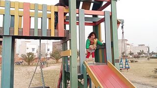 Dawood and Zeenia are playing in little kids amusement park