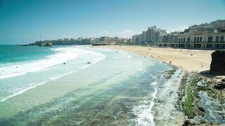 Ocean waves bursting on the shore of the coast