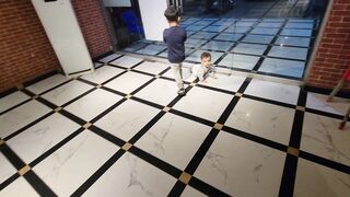 Funny babies r playing at restaurant