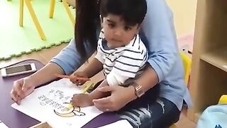 Ali at Pre-nursery school with teacher