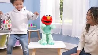 Sesame Street Dino Stomp Elmo 13 Inch Plush Stuffed Animal Sings and Dances Officially Licensed Kids Toys for Ages 18 Month, Gifts and Presents