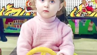 Cute baby girl play with toys car