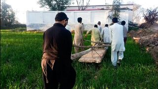Eight men taking heavy stone very hard work