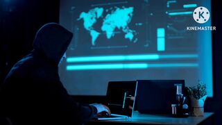 A hacker with the laptop in a dark room