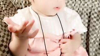 Very Cute Baby Girl acting on a song
