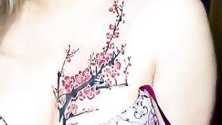 She got tatoo on top of her boobs