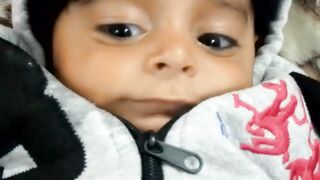 A little baby boy trying to conversate with mom