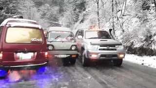 Car s slip in ice road heavy snowfall