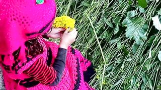 Cute baby collecting mustard flowers