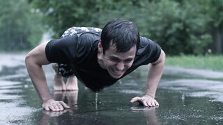 Man Training Outdoors While Raining