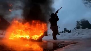 Russian soldiers run through fire in extreme military training drills