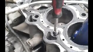 Remove cylinder head broken bolt from short block.