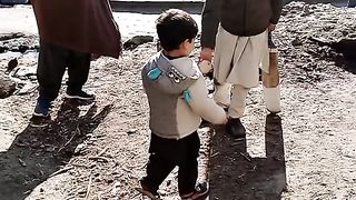 Cute baby playing cricket
