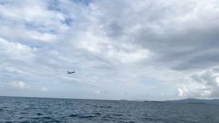 Private Jet Flying Real Low Over The Sea