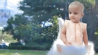 Funny Baby Riding A Cat