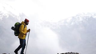 Man Climber on Summit Mountainside