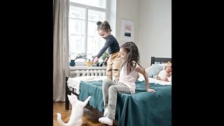 Naughty kids making fun with cat