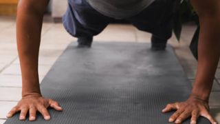Young Man Doing Push-Ups On The Floor