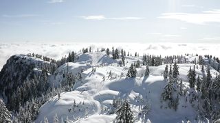 Snowy hills with clouds