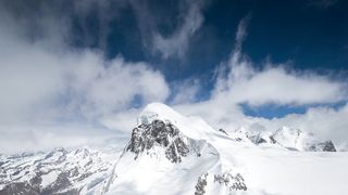 Clouds touching the tip of Matterhorn Mountain