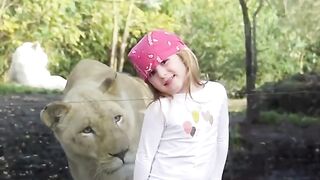little girl facing the lion