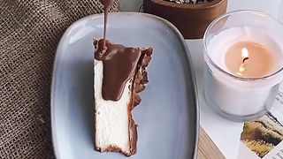 Pouring a Chocolate Syrup on a Slice of Cake
