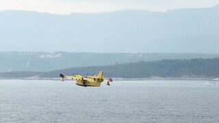 canadair fire fighting plane flying over Adriatic sea