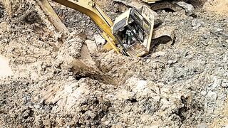 heavy excavator collapsed in the mud