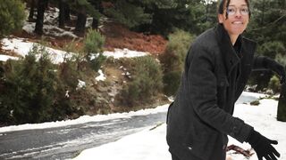 A Cover man getting hit with Snowballs