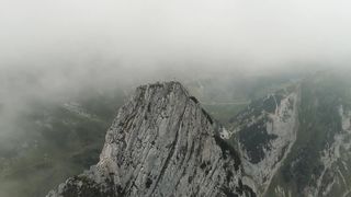 large mountain, covered with clouds