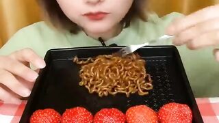 Maggie and Strawberry eating.