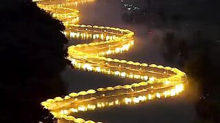 The shining dragon was cruising along a river - how spectacular!