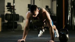 Muscular Man Doing Push-Ups In The Gym
