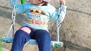 Baby girl enjoying swing jhola