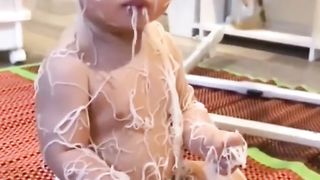 Innocent Baby enjoying Noodles