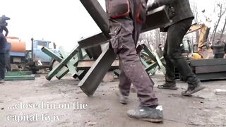 Ukrainians assemble anti-tank barricades as Kyiv braces for Russian onslaught Russia