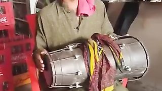 Pakistani singer singing a song which name is bismillah karan.