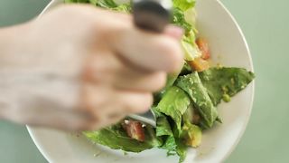 Eating salad with a fork