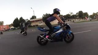 Crazy_girl_does_motorcycle_stunts_on_St._Louis_streets_2015.