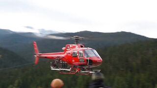 Helicopter ???? takes off in valley.