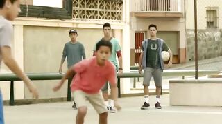 STREET CHILD PLAYING FOOTBALL WITH MESSI