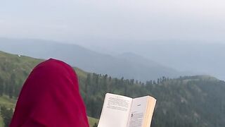 natural beauty, reading a book, and taking in the scenery and the weather while reading a book